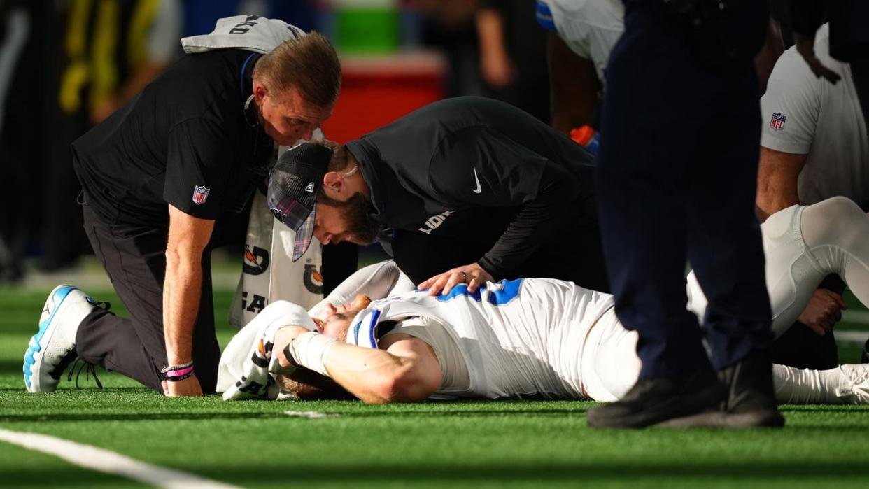 <div>ARLINGTON, TEXAS - OCTOBER 13: Aidan Hutchinson #97 of the Detroit Lions is tended to by medical staff after injuring his leg while recording a sack on Dak Prescott #4 of the Dallas Cowboys in the third quarter of a game at AT&T Stadium on October 13, 2024 in Arlington, Texas. (Photo by Sam Hodde/Getty Images)</div>